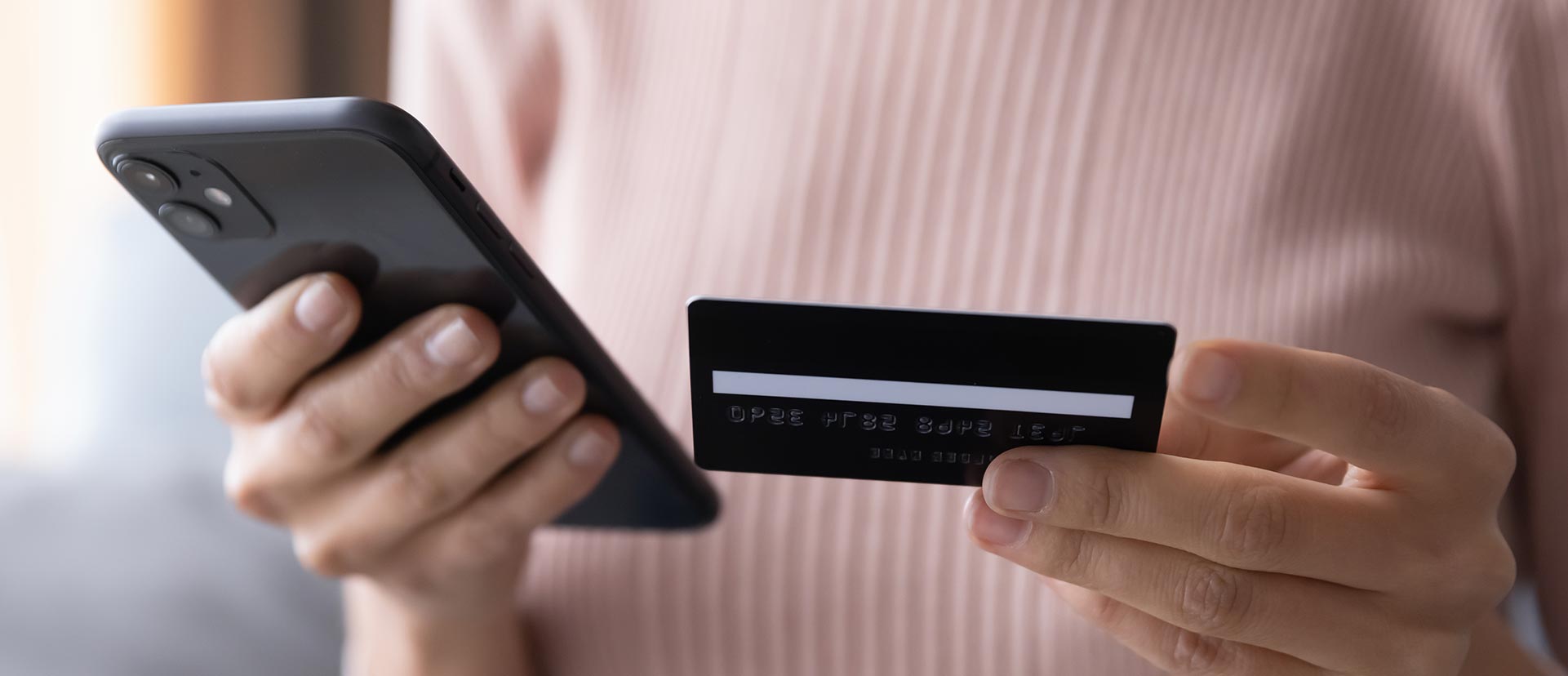 Woman using a credit card for online payment