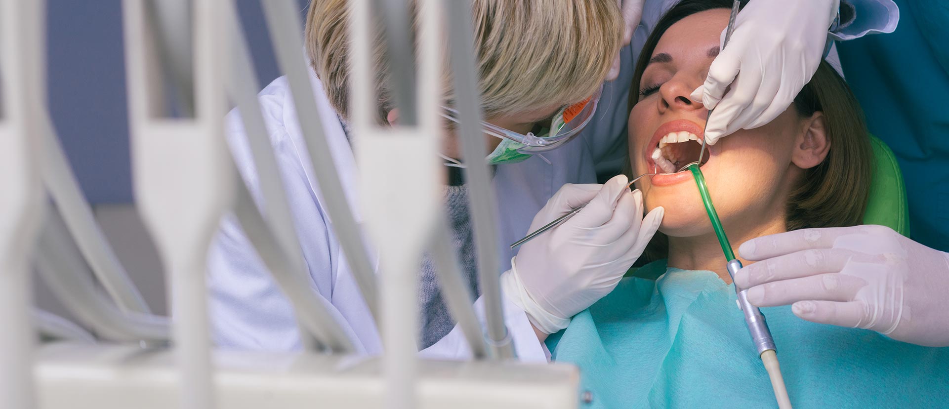 Woman is having a dental emergency surgery