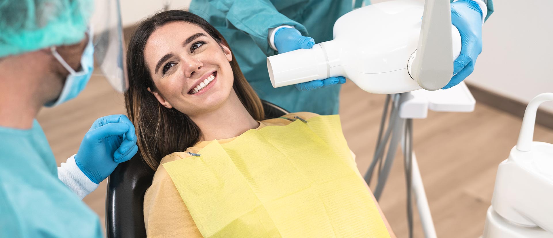 Woman is smiling after having a root canal therapy