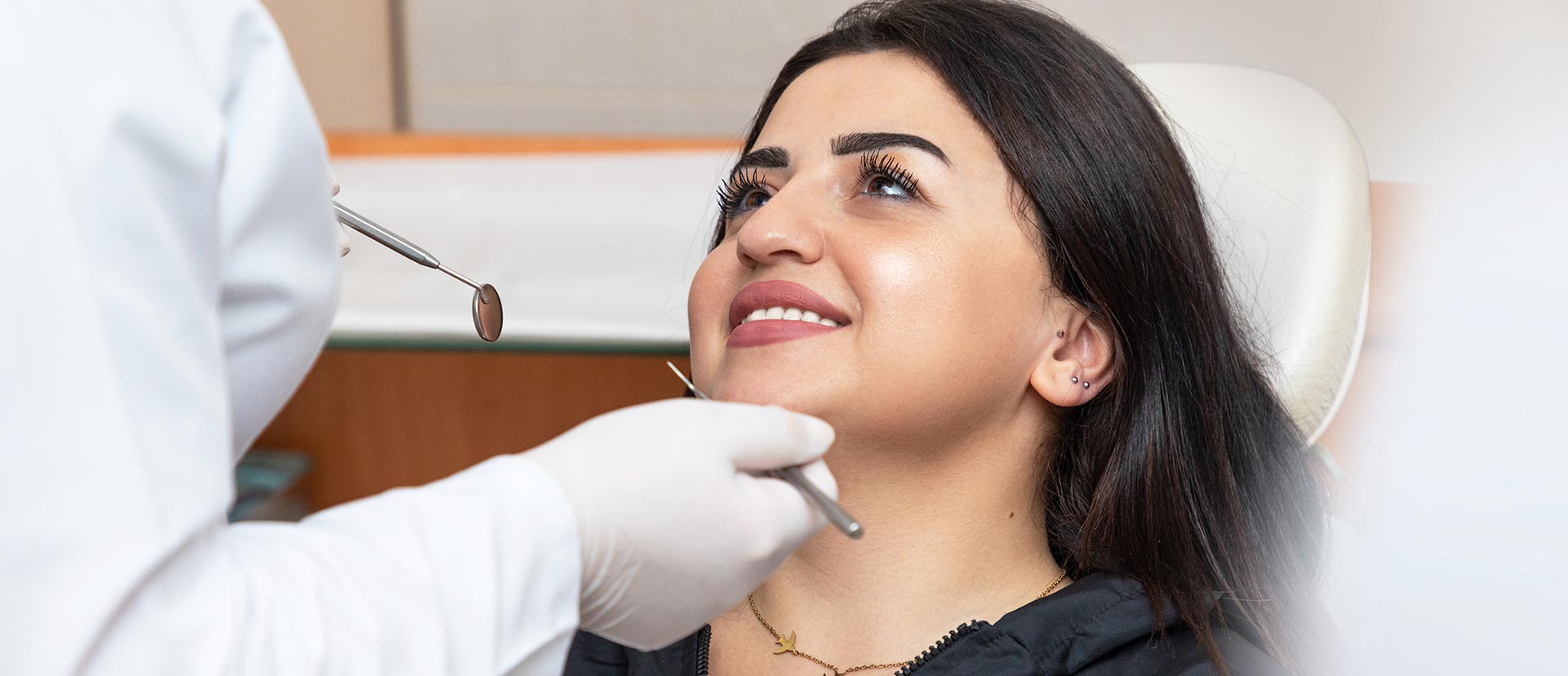 A woman is having a same-day dental crown